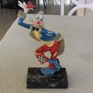 Home a Clown that is happy on a marble stand made in Italy. *